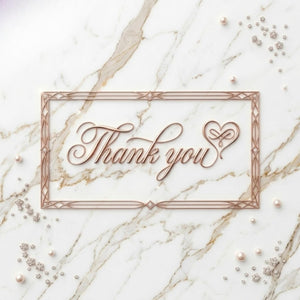 A rose gold rectangular frame with the words "Thank you" in elegant cursive script. The frame is on a white marble surface, adorned with scattered pearls and diamond-like embellishments.
