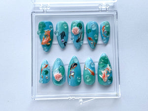 Ocean-Inspired Press On Nails | Hand Painted Koi Fish Nail Art | Blue with Underwater Flowers charms On Fake Nails | Ocean Nails | OB385T