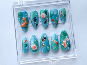 Ocean-Inspired Press On Nails | Hand Painted Koi Fish Nail Art | Blue with Underwater Flowers charms On Fake Nails | Ocean Nails | OB385T