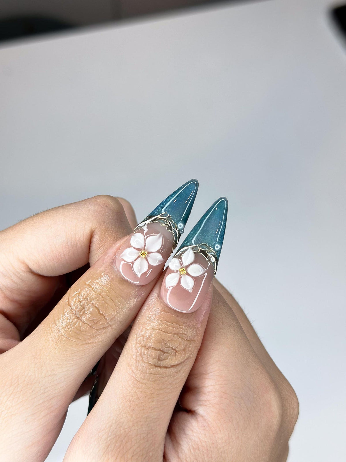 Teal Cat-Eye & 3D White Bloom Nails | Antique Gold Chrome Accents | Luxury Botanical Magnetic Stiletto Art | Elegant Nails | OB379IK