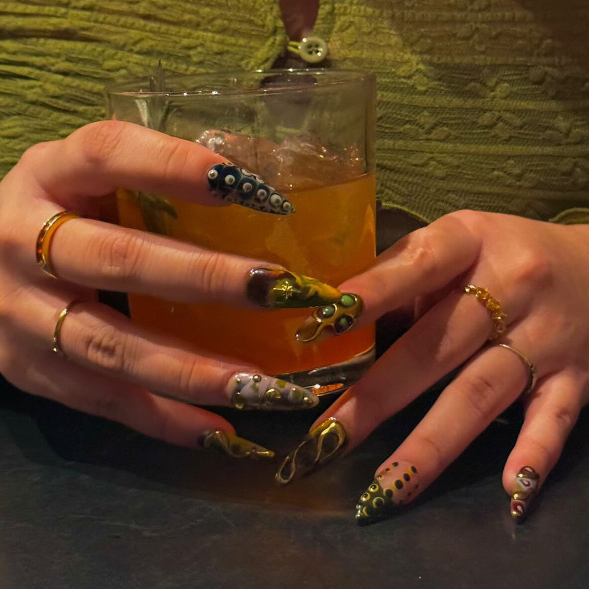 3D press on nails with textured gold swirls and earthy tones of green, brown, and amber — long fake nails, handmade artistic nail art, reusable press ons, perfect for fall outfits or bold aesthetic lo