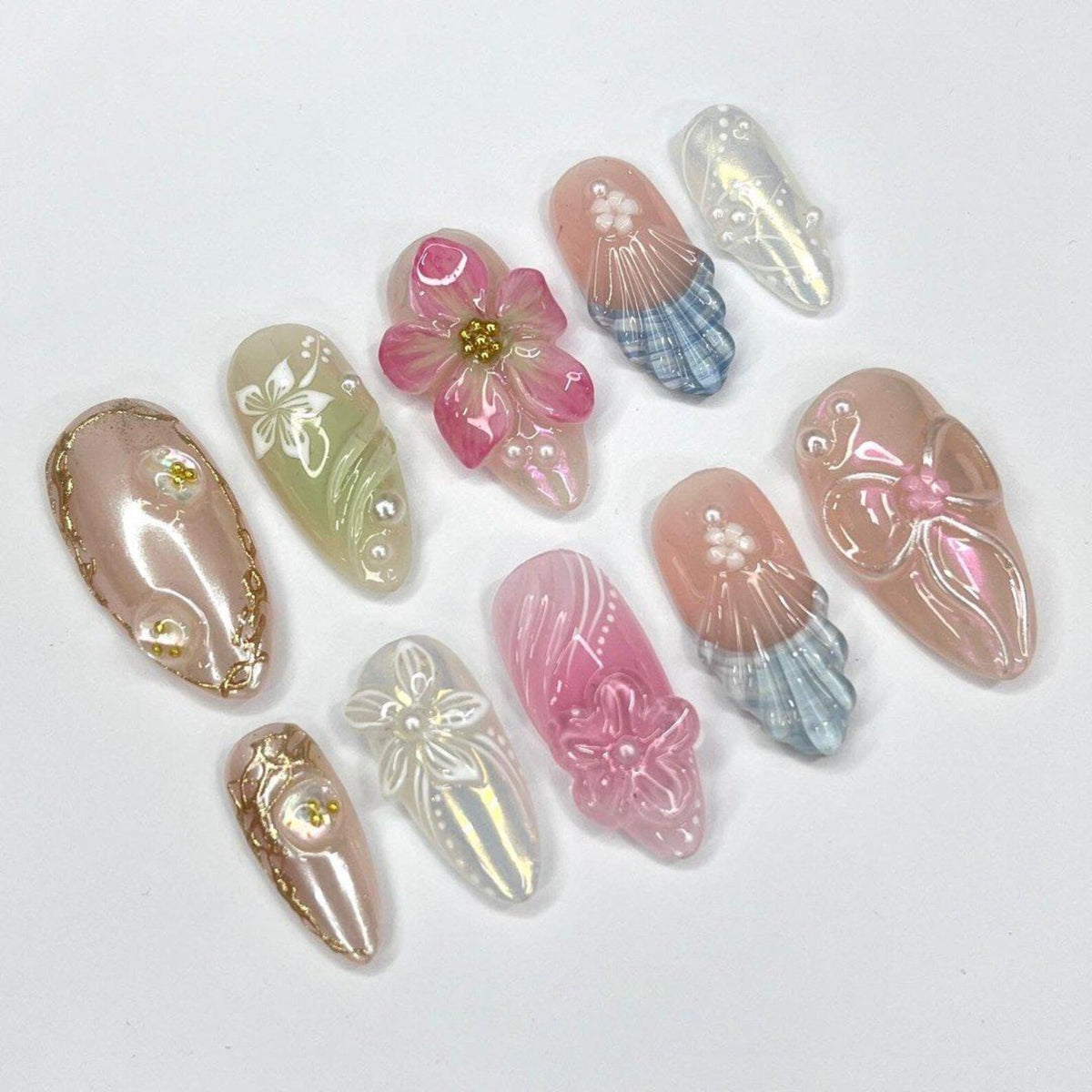 3D summer press on nails with pastel pink, green, and blue floral designs, embellished with pearls and sculpted bows — custom press on nails, luxury handmade nail art, fake nails, false nails, presson