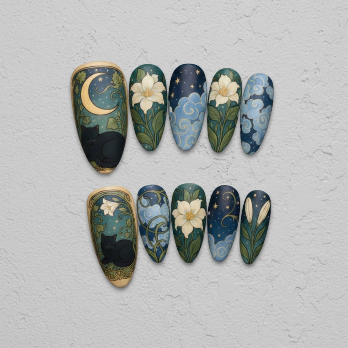 A set of ten artificial nails with various designs. The designs include a black cat under a crescent moon, white flowers, blue clouds, and a starry night sky. The nails are almond-shaped and painted with intricate details.