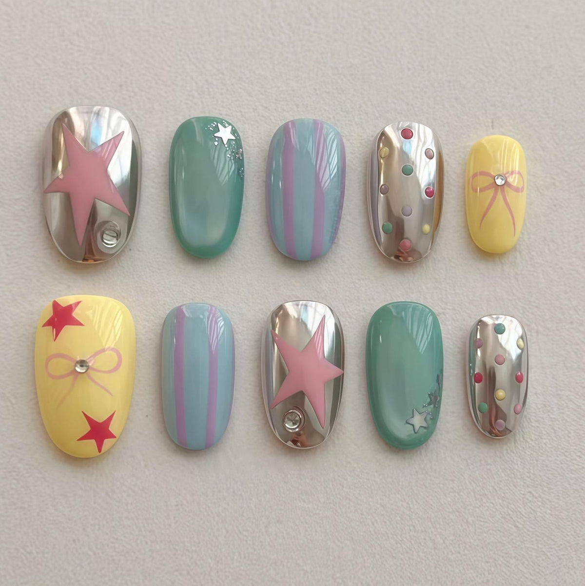 A set of three ceramic mugs with a speckled, matte finish. Each mug features a different color: light blue, cream, and gray. The mugs have a simple, modern design and a comfortable handle.