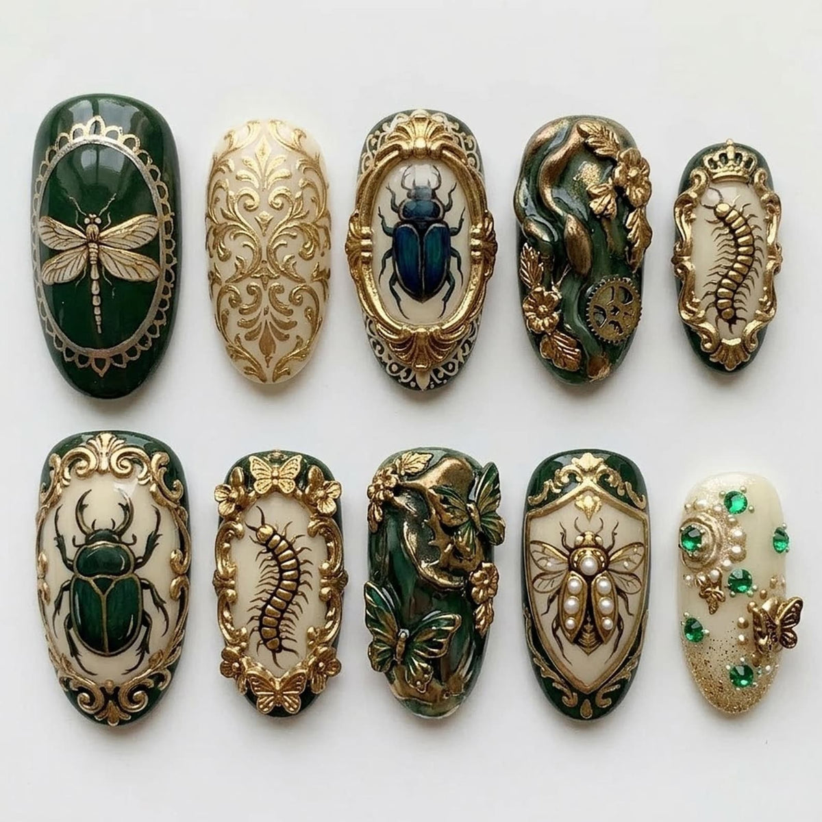 A collection of ten intricately designed artificial nails. Each nail features detailed insect and floral designs in gold, green, and cream colors. The designs include dragonflies, beetles, butterflies, and ornate patterns.