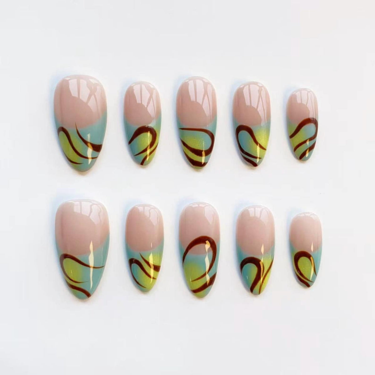 A set of ten oval-shaped false nails. Each nail features a light pink base, a gradient of light blue and yellow, and a dark brown swirl design. The nails are arranged on a white surface.