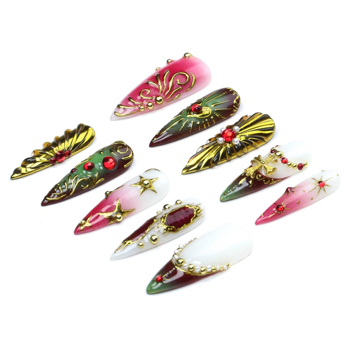 A set of ten stiletto-shaped press-on nails featuring various designs including red, green, and white gradients, gold metallic filigree, star accents, small pearls, and embedded red rhinestones arranged in a scattered pattern.