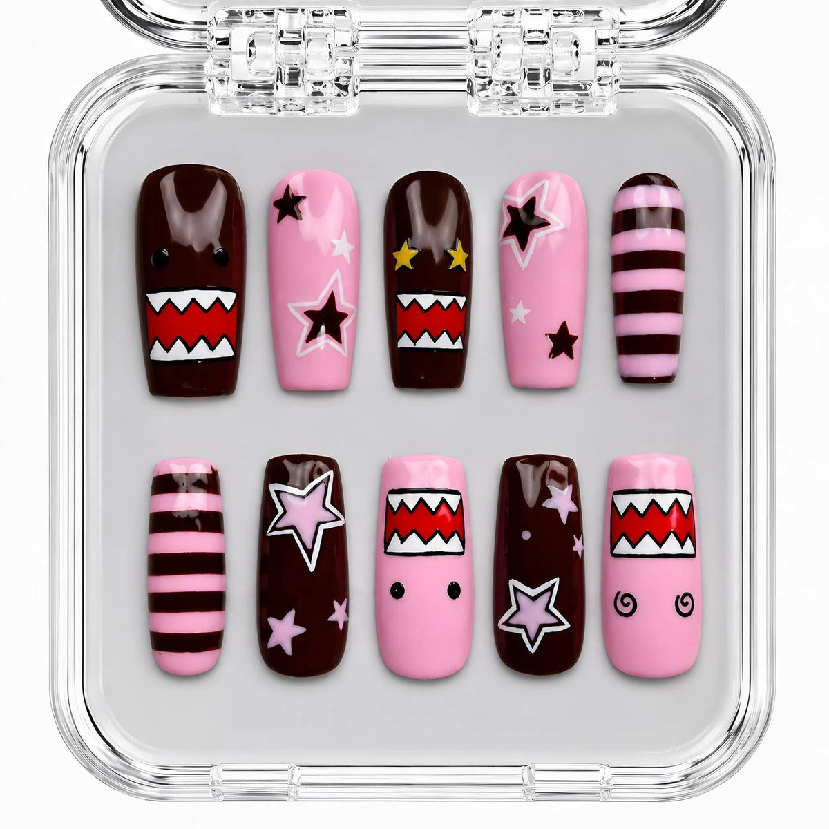 A set of ten handmade long coffin press-on nails featuring glossy pink and black designs with bold star accents, checker patterns, abstract graphics, striped details, and a salon-quality finish. Reusa
