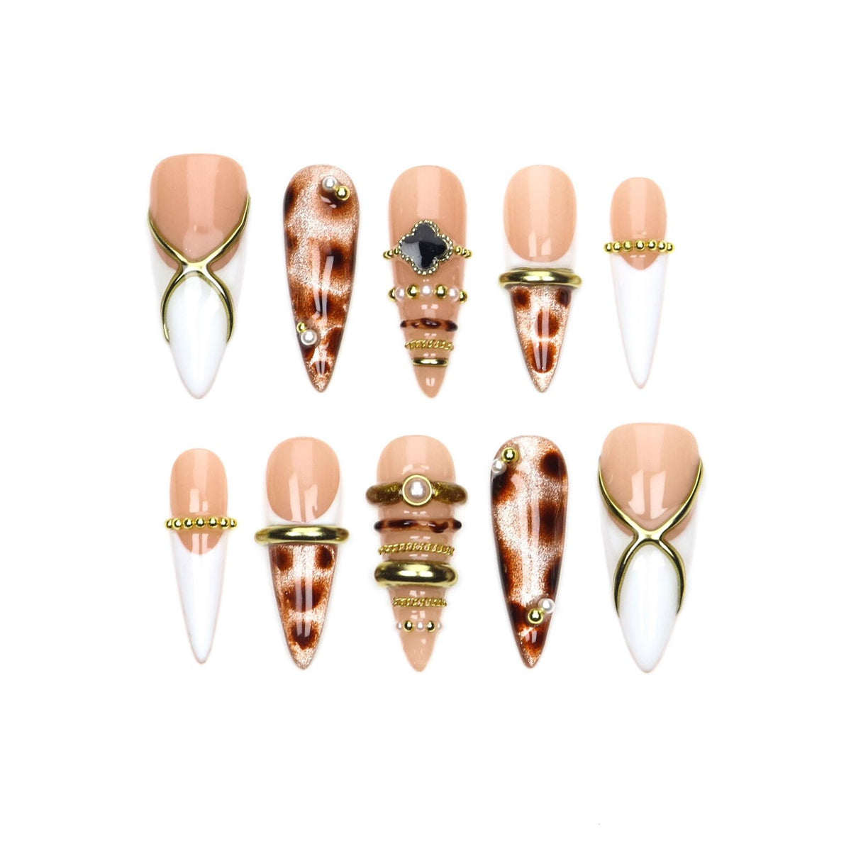 A set of ten stiletto-shaped press-on nails featuring a mix of nude and white bases. Designs include leopard print patterns, gold metallic cross overlays, small pearl accents, and stacked gold-toned rings across the nail surfaces.