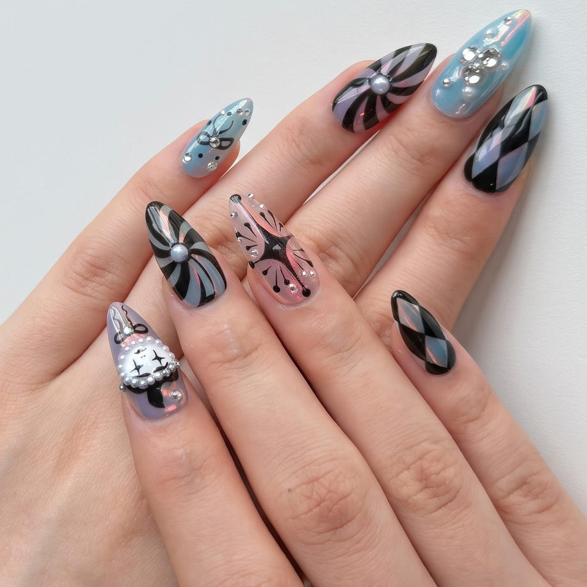 Handmade clown press on nails with vintage clock design, pastel pink and turquoise colors, Harlequin diamond pattern, gothic circus aesthetic, long almond fake nails featuring rhinestones, bows, and whimsical clowncore nail art perfect for cosplay, H