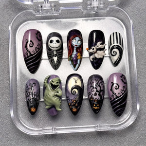 A set of ten almond-shaped press-on nails in a clear plastic case, featuring detailed hand-painted designs inspired by The Nightmare Before Christmas, including characters like Jack Skellington, Sally, Zero, and Oogie Boogie with pumpkins.